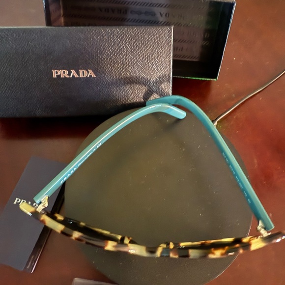 Authentic Prada tortoise/cheetah Cat Eye  Sunglasses
See photos for callout main image 5